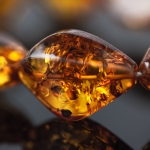 Glitters inside the amber bead
