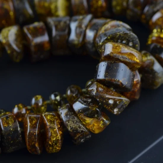 Green tabled bead amber necklace with baroque beads
