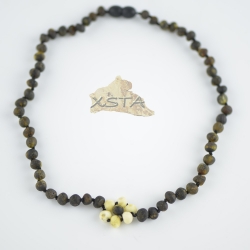 Dark green necklace with white flower