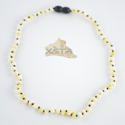 Raw white necklace with knots on black thread Raw white necklace with knots on black thread