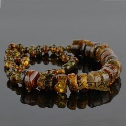Green tabled bead amber necklace with baroque beads