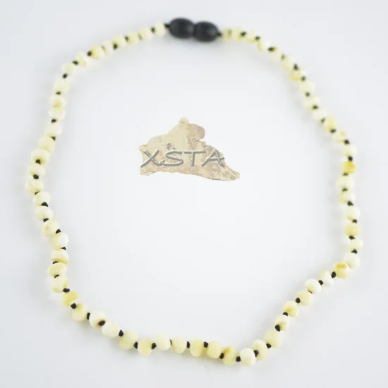 Raw white necklace with knots on black thread
