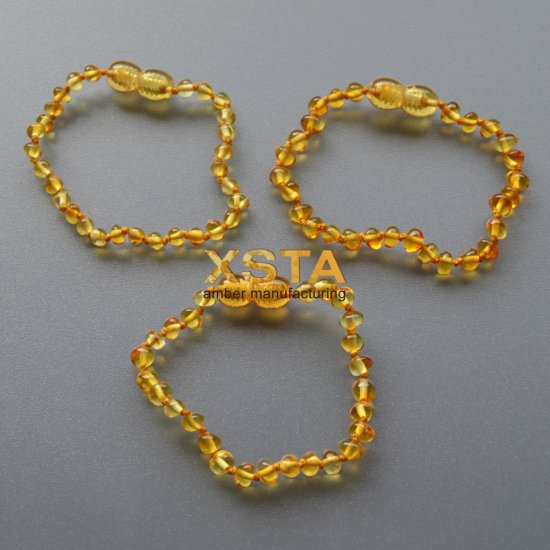 Amber teething bracelet baroque light honey polished