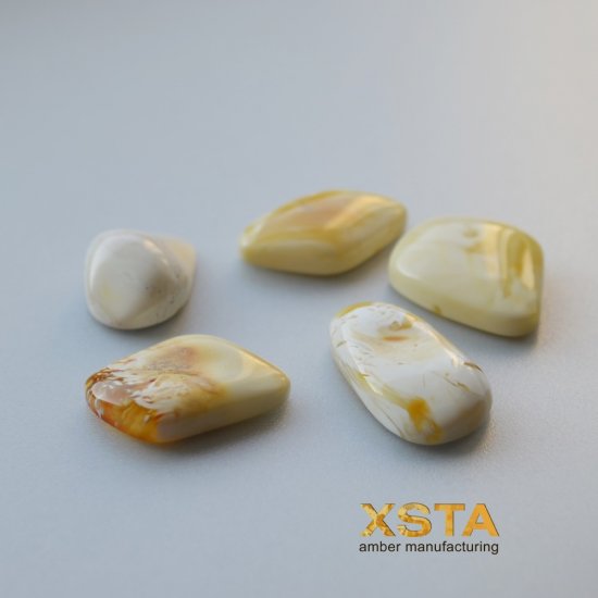 Cabochons from butter amber